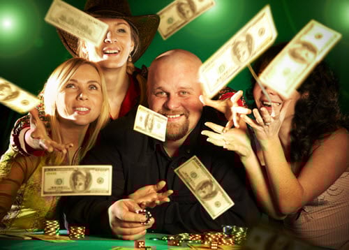 People enjoying casino winnings with flying cash.