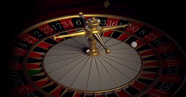 Roulette wheel with spinning ball.