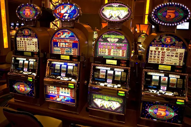 Casino slot machines with colorful displays.